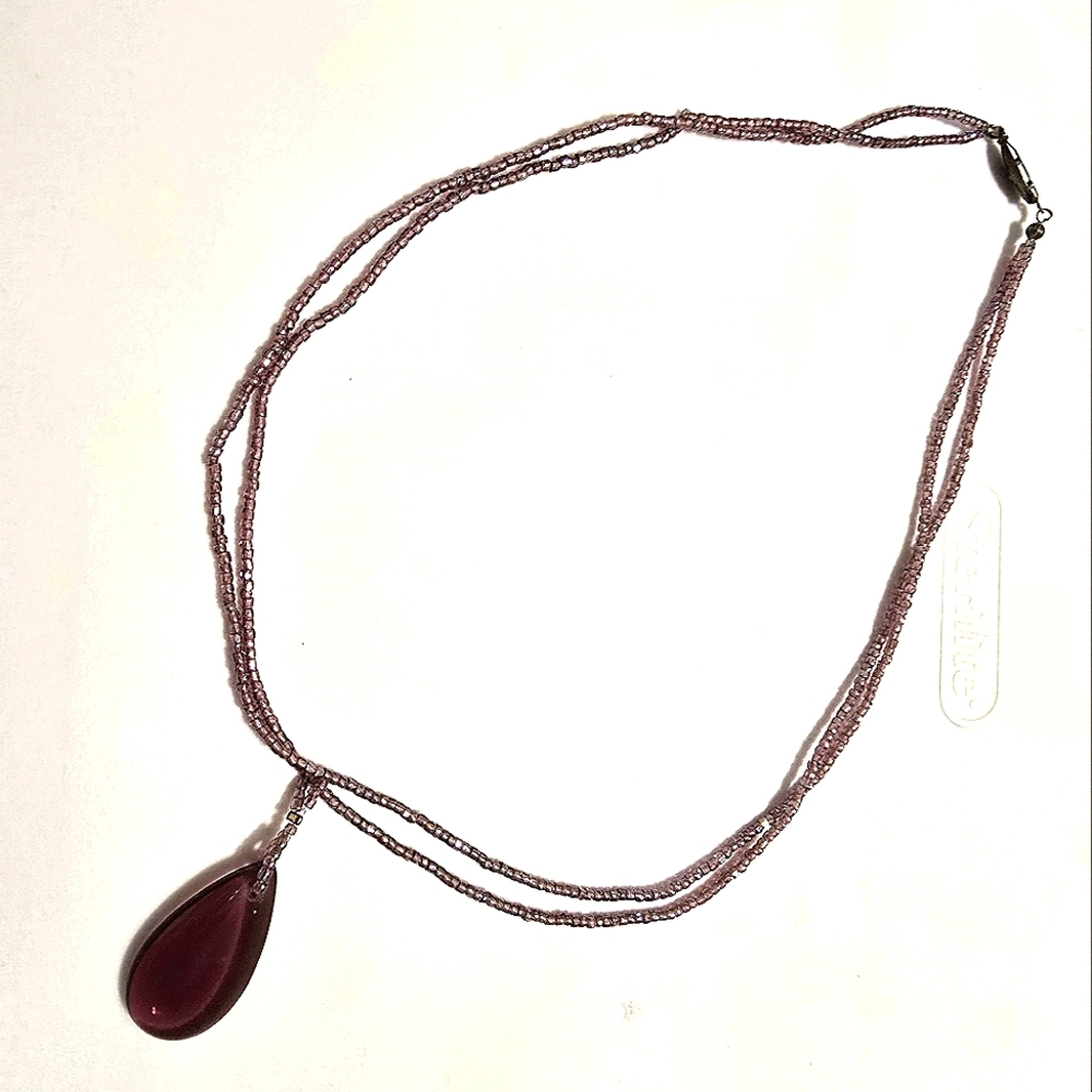 Purple beaded necklace with pendant
